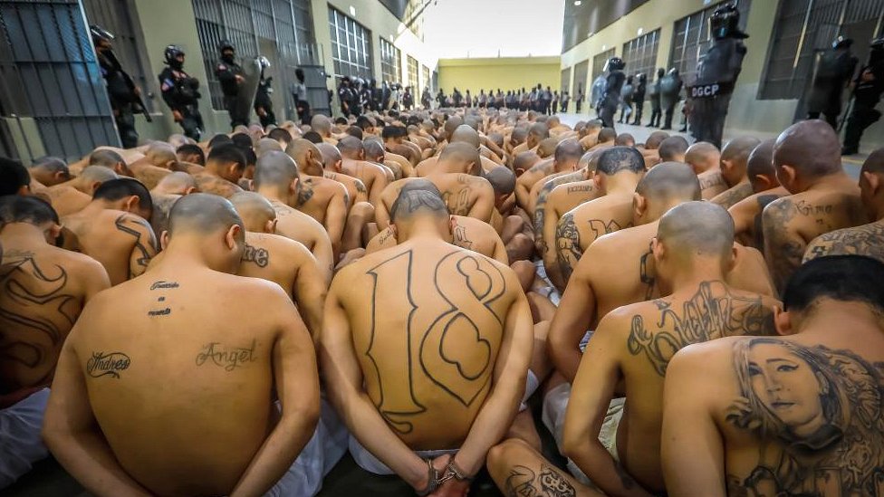 Gang members wait to be taken to their cells after 2000 gang members were transferred to the Terrorism Confinement Center