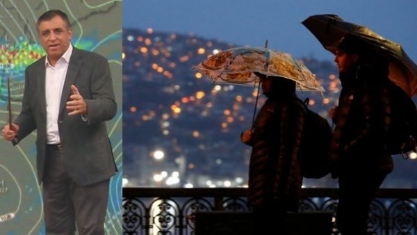 Iván Torres y personas caminando bajo la lluvia con paraguas.
