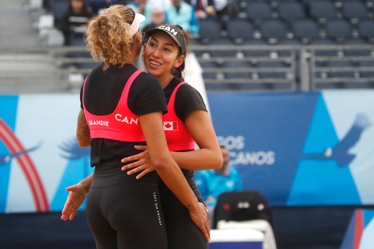 Melissa Humana-Paredes and Brandie Wilkerson celebrate a point against Paraguay's at the Santiago 2023 Pan American Games