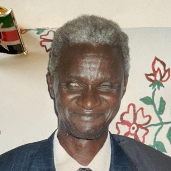 Retrato de John Kimuyu