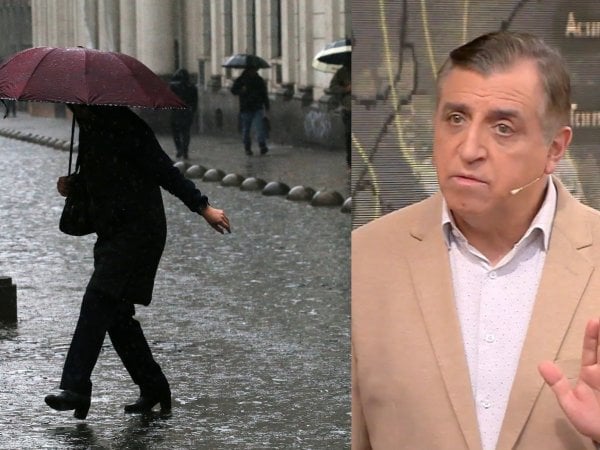 Iván Torres y persona bajo la lluvia con paraguas.