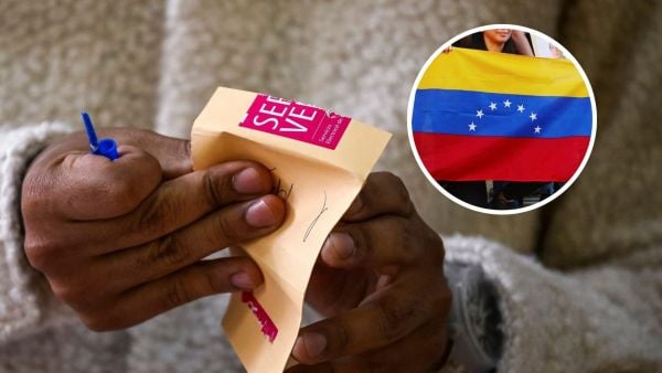 Persona con voto del Servel y bandera de Venezuela.
