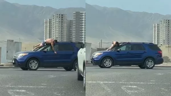Captura de pantalla que muestra a un hombre semidesnudo sobre el parabrisas de un vehículo azul
