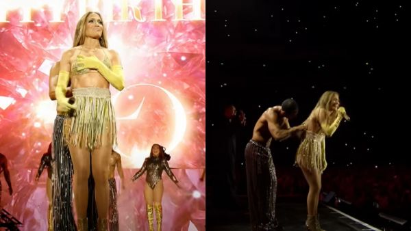 Jennifer Lopez sobre el escenario con un top y falda dorada. Jennifer Lopez hablando al público, con un bailarín atrás de ella intentando arreglar su falda