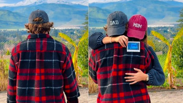 Hombre de espaldas a la cámaras con camisa cuadrille negra con rojo.