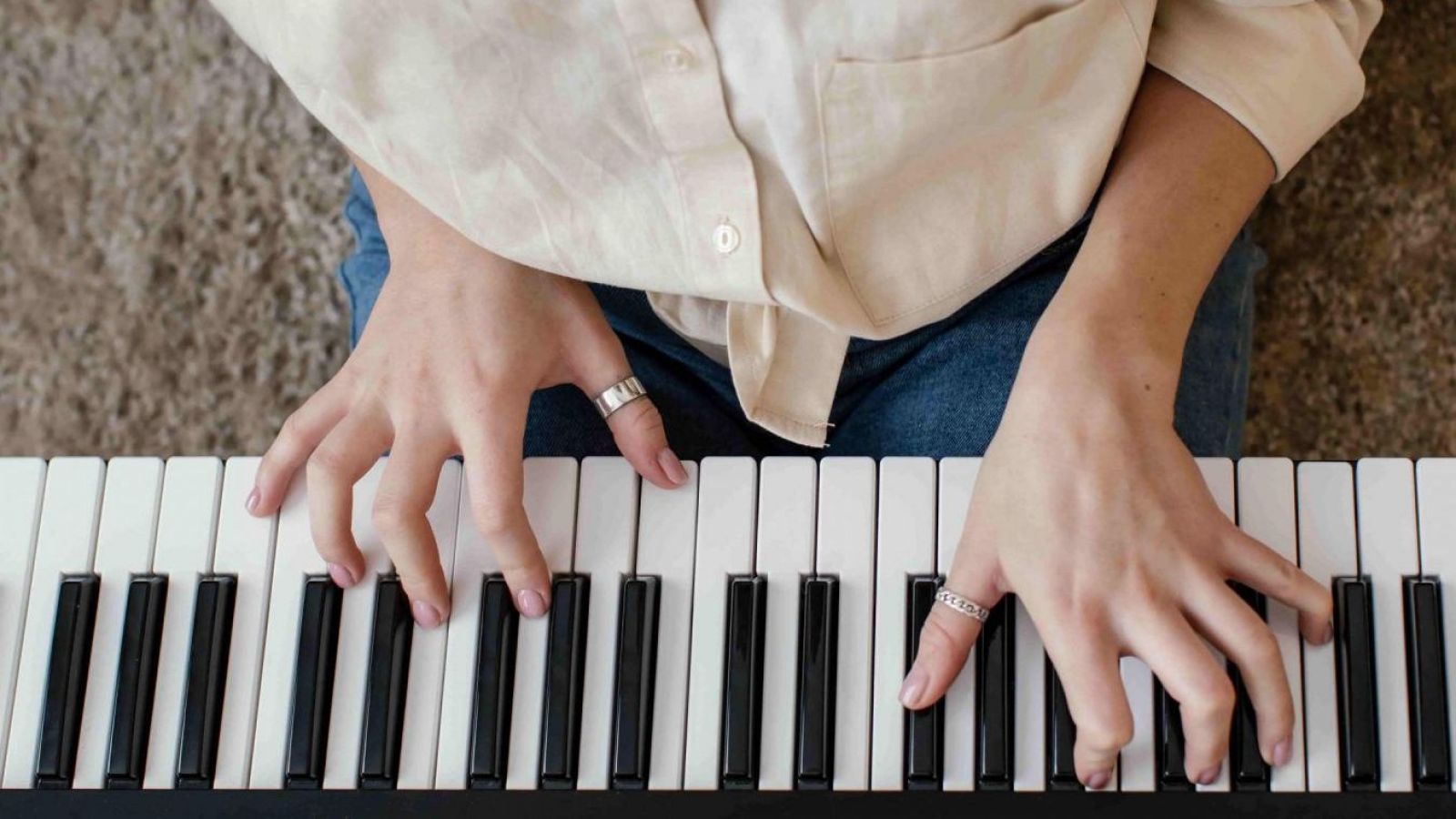 Person playing music on a keyboard