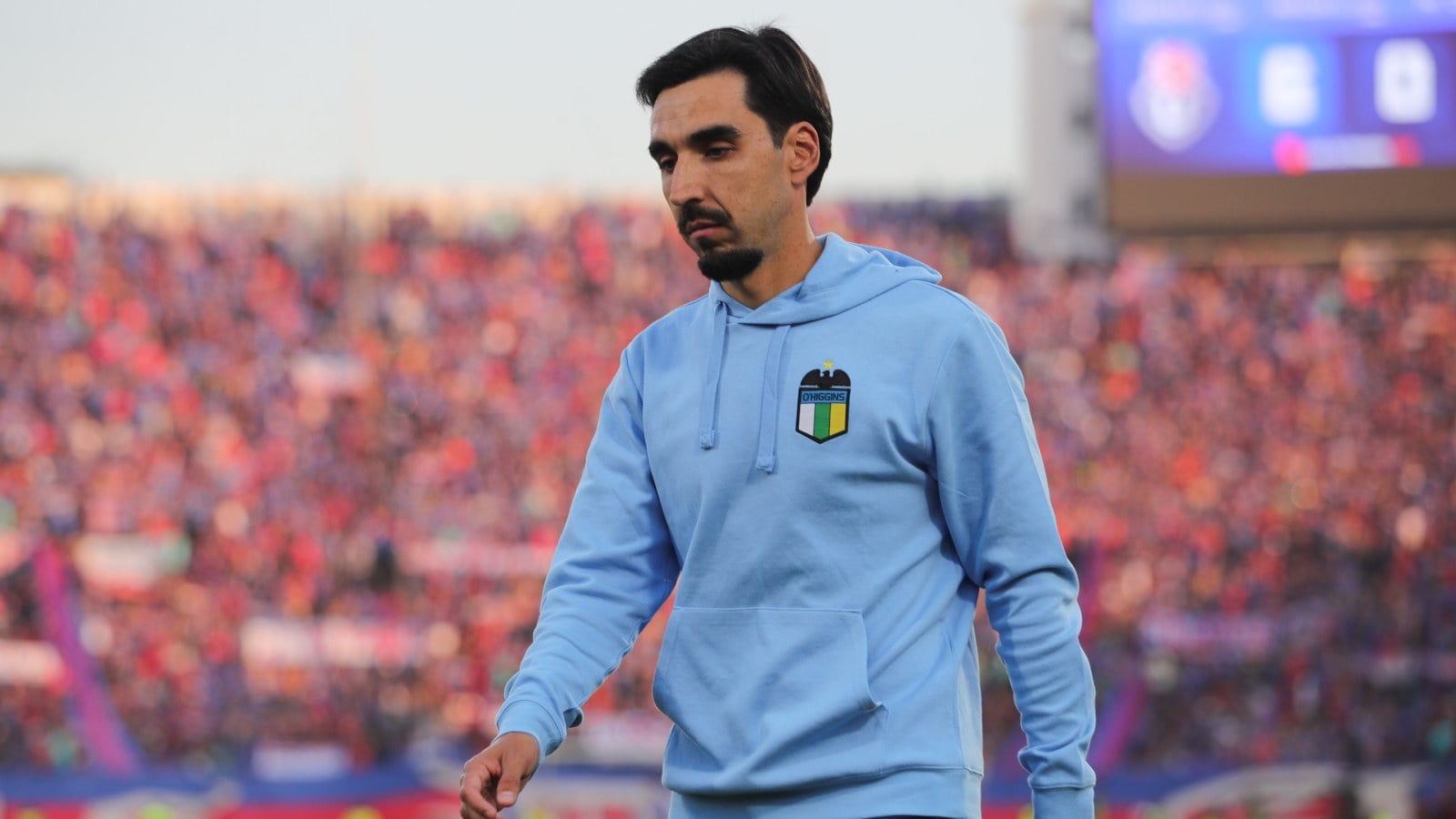 Francisco 'Paqui' Meneghini dirigiendo un partido de O'Higgins