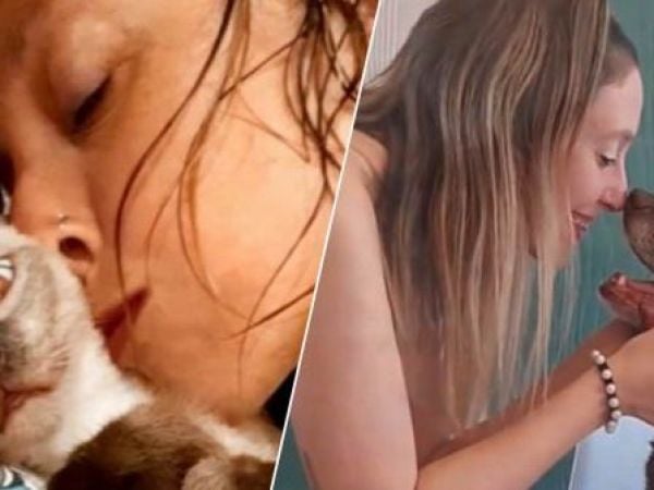 Mujer con sus mascotas en Rosario, Argentina