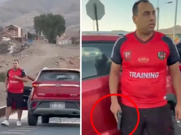 Funcionario de carabineros portando un arma tras un partido de fútbol amateur